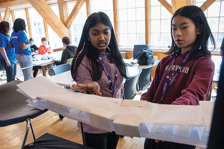 Two Michael P. Anderson Memorial Aerospace Program students discuss their wing design during an activity facilitated by engineers from The Boeing Company.