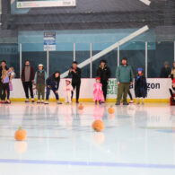 Pumpkin curling at Kraken Community Iceplex, where families enjoy a fun and kid-friendly Halloween activity on the ice.