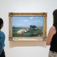 Visitors take a closer look at a vibrant cow painting inside Seattle Art Museum’s Farm to Table exhibit, a family-friendly exploration of how our food is grown and gathered.